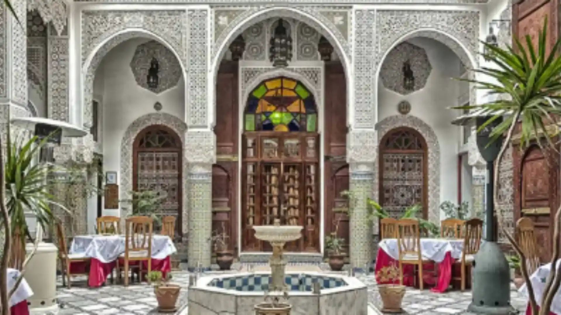Central courtyard of Funduq al-Najjariyyin in Fez, showcasing traditional Moroccan architecture within the historic medina.