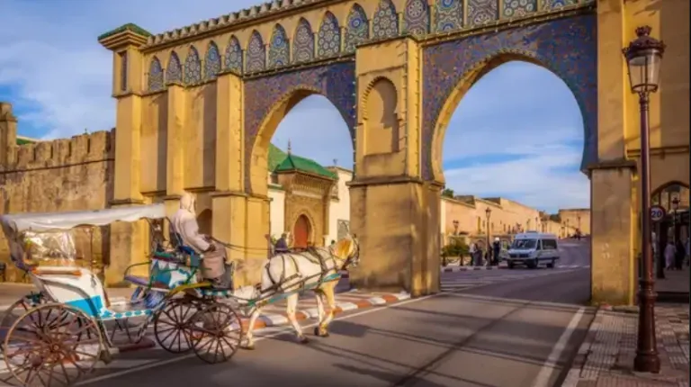 Morocco Itinerary 12 Days 35 Historic Bab Mansour gate in Meknes, Morocco, showcasing Spanish-Moorish architectural design.