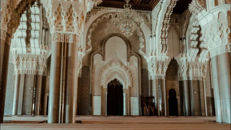 Morocco Itinerary 10 Days 4 Interior prayer hall of the Hassan II Mosque in Casablanca, featuring intricate Moroccan design, captured for a 10 days morocco itinerary.