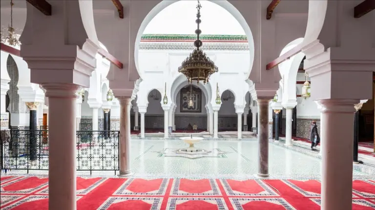 Morocco Itinerary 12 Days 38 A peaceful courtyard featuring traditional arches, tiled floors, and historic Islamic architecture.