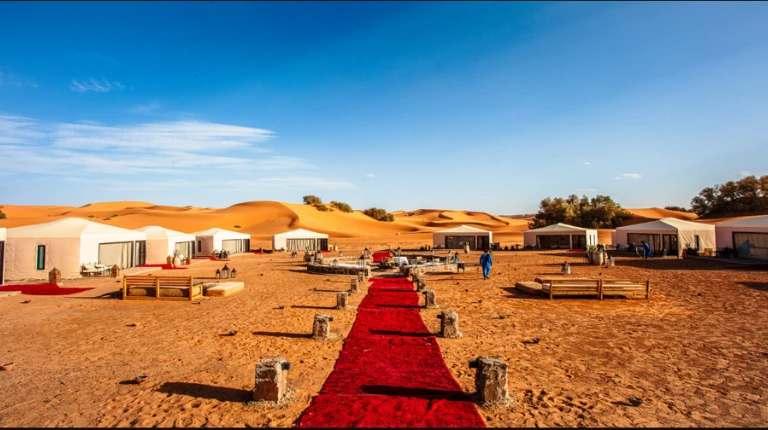 Fes to Marrakech Desert Tour 4 Days 7 Luxury desert camp in Merzouga with elegant tents and red carpet experience by Morocco Fun Tours.