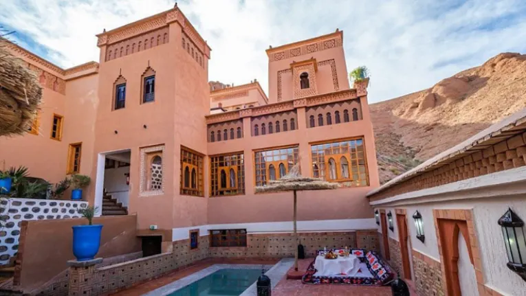 Morocco Itinerary 10 Days 11 Exterior and pool area of Luxury Riad Dades in Aït Idaïr, featured in a 10 days in morocco itinerary.