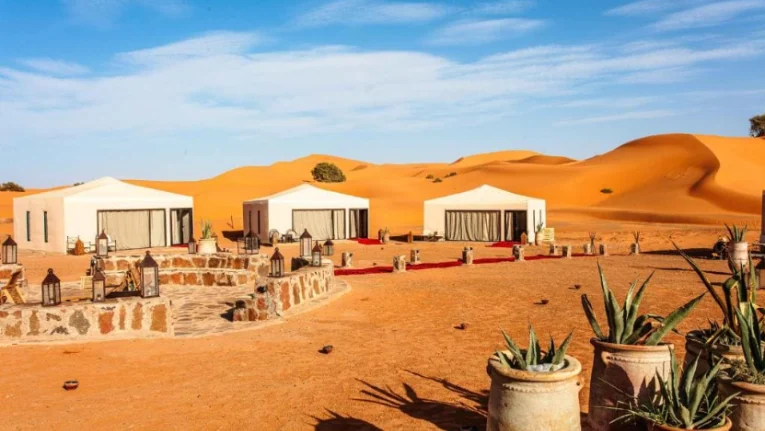 Morocco Itinerary 10 Days 10 Luxury desert camp in Merzouga, captured during a Morocco Fun Tours experience, set among the serene dunes of the Sahara.