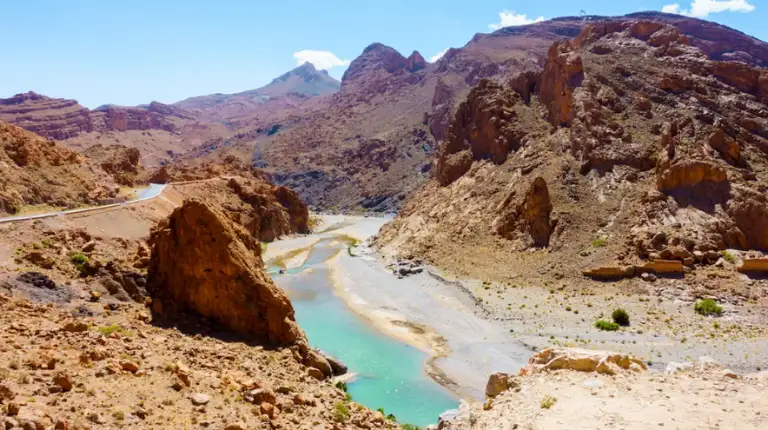 Morocco Itinerary 12 Days 39 Ziz River flowing through dramatic mountain gorges along a scenic route in a 12 days Morocco itinerary.