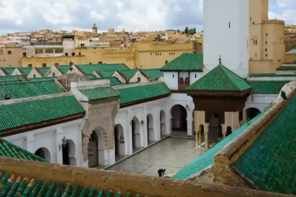 Courtyard and green-tiled roofs of University of al-Qarawiyyin, Fez, Morocco, captured by Morocco Funt Tours.
