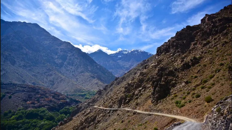 Jebel Toubkal peak rising above rugged atlas bergan landscape with rocky slopes and scenic mountain views in the High Atlas