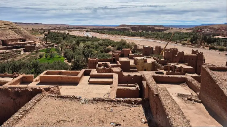 Aït Benhaddou ksar with earthen clay architecture along historic caravan route, featured during marrakech 2 day desert tour experience