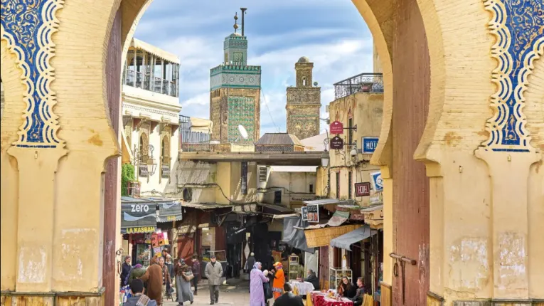 Fes el Bali medina with historic alleyways and Kairaouine Mosque minaret visited during the 3 days tour from marrakech to fes
