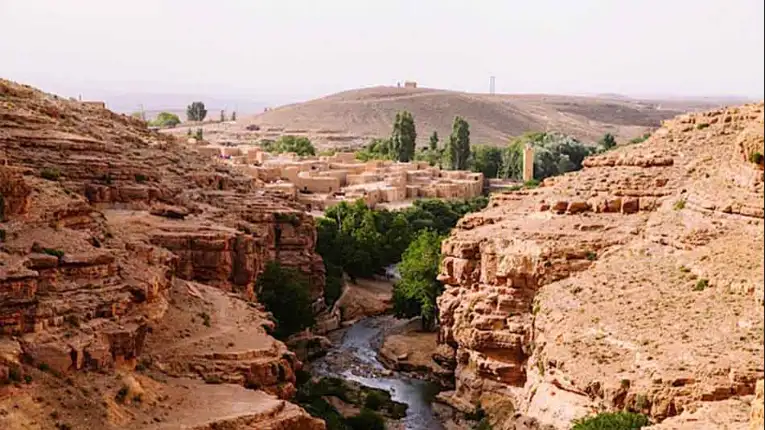 Gorges des Berrem near Midelt with rocky cliffs, river valley, and palm groves explored through Morocco Fun Tours experiences