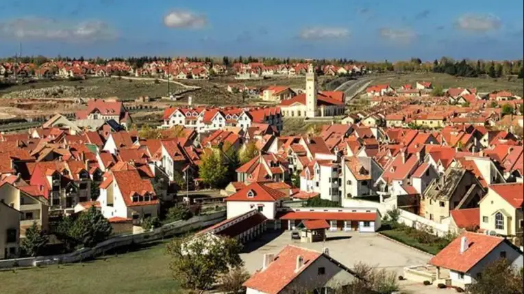 Ifrane city with alpine style houses, red tiled roofs, and mountain surroundings creating distinctive European inspired atmosphere