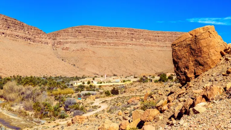 Deep gorges and vast palm groves in Ziz Valley with ksour villages along Ziz River between Atlas and Sahara landscape