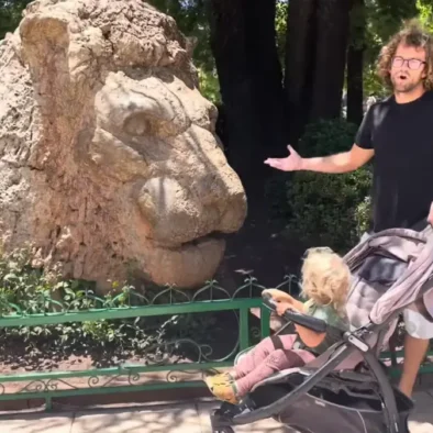 Stone Lion sculpture in Ifrane surrounded by cedar trees and gardens