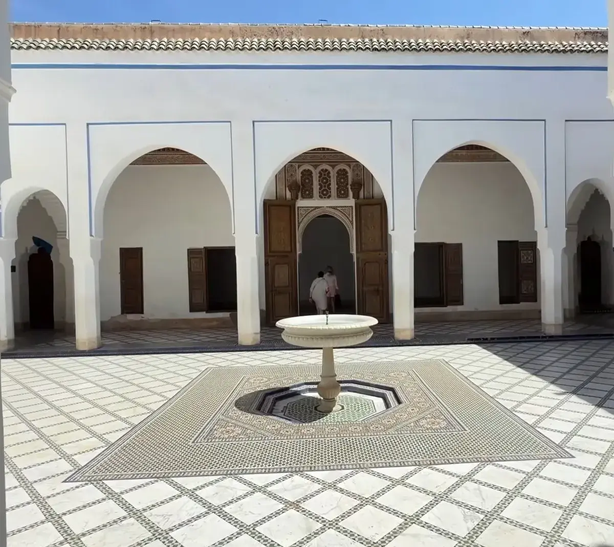 Home 3 Bahia Palace courtyard in Marrakech with traditional arches and mosaic tiles featured in Morocco Tours experiences