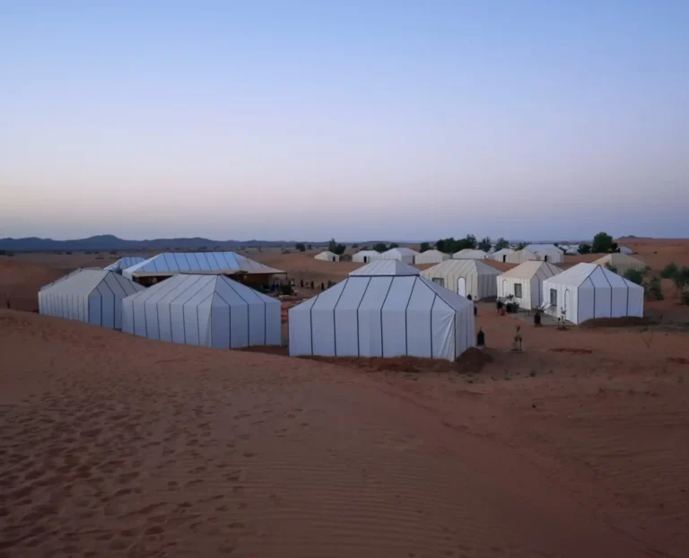 luxury desert camp nestled among the sand dunes of Erg Chebbi in the Sahara Desert near Merzouga
