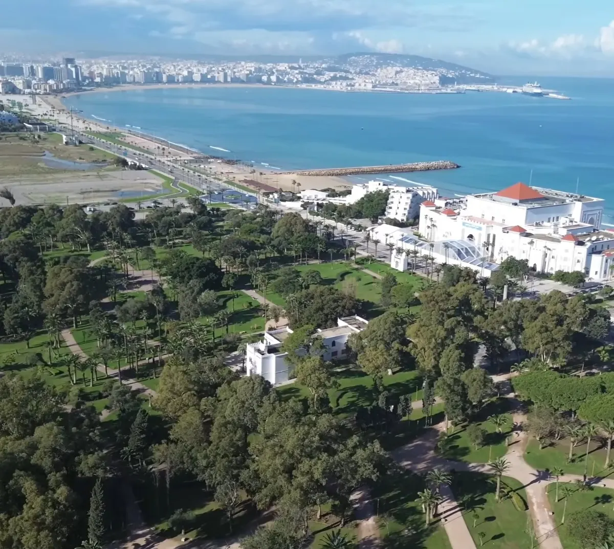 Home 11 Tangier coastal city and waterfront viewed from above, with beaches, parks, port, and Mediterranean coastline in Morocco Tours